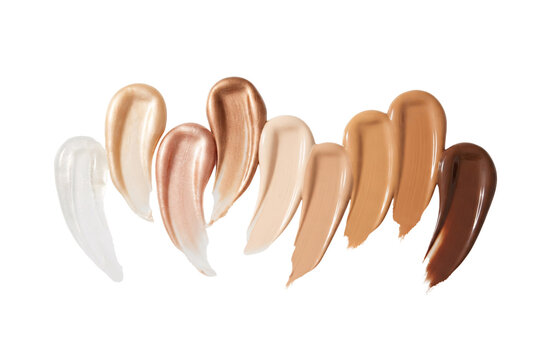 Nine swatches of liquid foundation and highlighter makeup creams arranged in various skintone shades from light to dark tones
