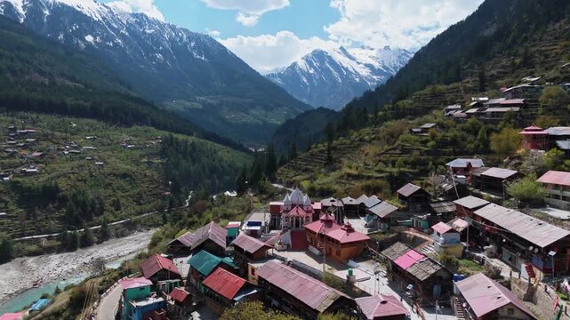 Aerial Drone View of Mukhwa Ganga Temple in Uttarakhand Surrounded by Lush Green Himalayan Mountains