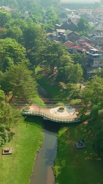 Aerial Yogyakarta urban park with canal and surrounding neighborhood