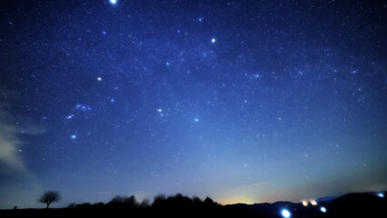 Orion constellation, zodiacal light and Milky Way stars on a dark countryside skies. © astrosystem