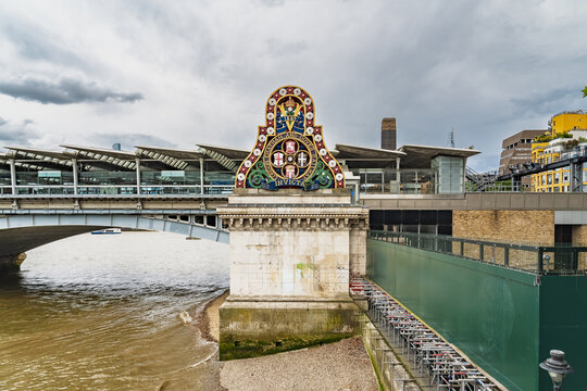 View of the ornate crest of the London, Chatham and Dover Railway on the Blackfriars Railway Bridge spanning the River Thames in London, England, United Kingdom.