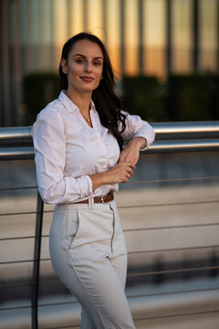 Professional woman posing confidently in urban business environment