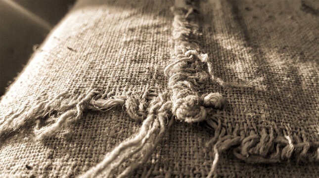 Macro Close Up Weathered Worn Frayed Jute Sack Fabric Texture In Sunlight