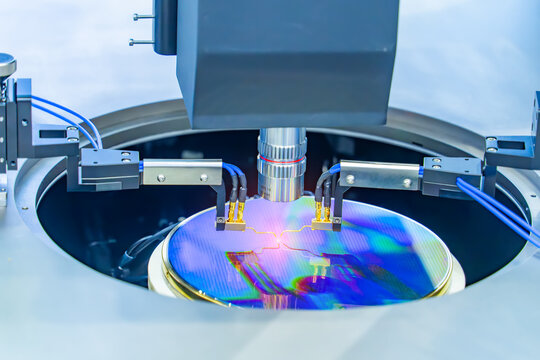 silicon wafer with needles for test of semiconductor on the probe station,examining a sample of microchip transistor,integrated circuits to manufacture CPU and GPU