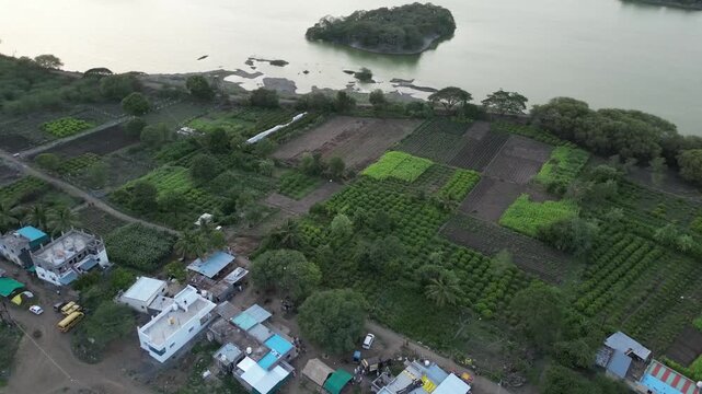 Drone Shot of Riverside Farming and a Serene Island.