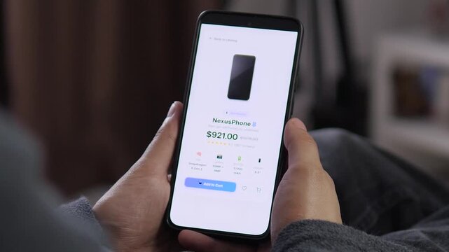 Shopper reviews a smartphone product page on a mobile store, reflecting digital commerce, price comparison and growing demand for convenient online purchasing.