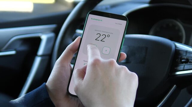 Driver remotely adjusts indoor temperature through a smart home app, highlighting energy efficiency, connected living and mobile climate control from anywhere.