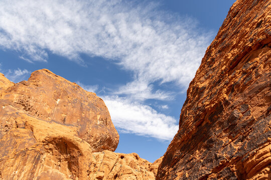 Red sandstone desert cliffs with blue sky dramatic rock landscape