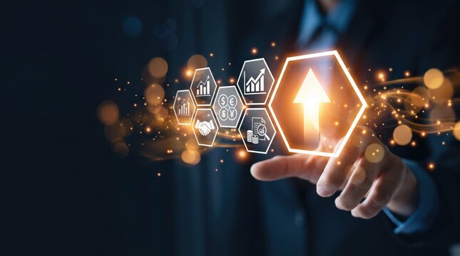 Close up of businessman hand touching glowing upward arrow icon in hexagon shape, surrounded by financial symbols like currency and charts, representing economic growth