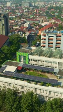 Solar panels covering rooftop of urban building in Yogyakarta