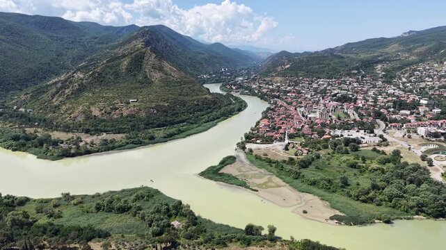 Aerial drone flight over the confluence of the Aragvi and Mtkvari rivers near Mtskheta, Georgia, a Caucasus landscape famously evoked by Mikhail Lermontov in his poem Mtsyri.