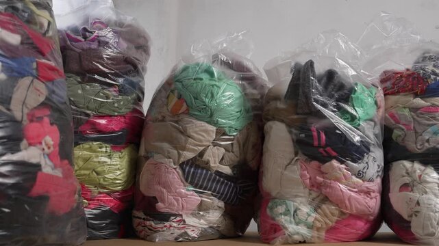 Bulk used clothing in bags for resale business. Second-hand and retail business