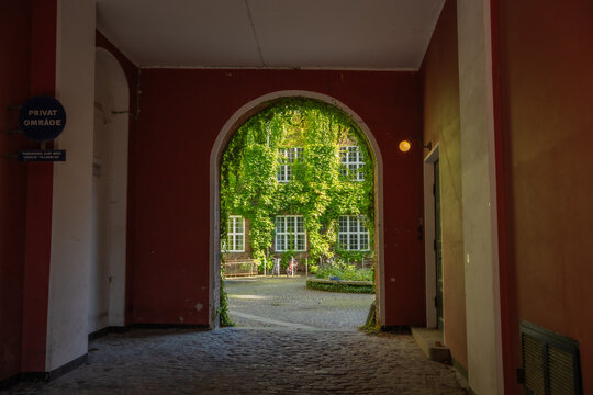 Charming Archway View to a Hidden Green Courtyard