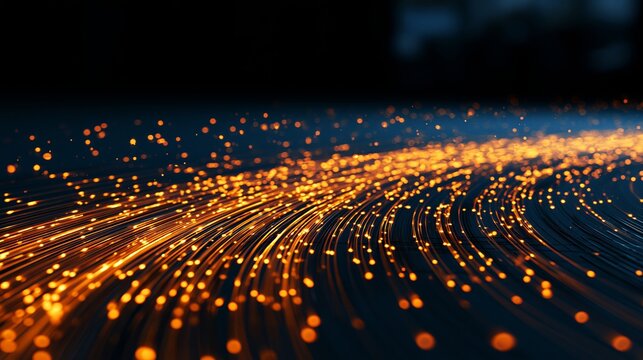 Glowing orange fiber optic cables transmit rapid digital data streams across a dark surface captured with a shallow depth focus
