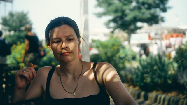 portrait of a young woman in dappled lighting