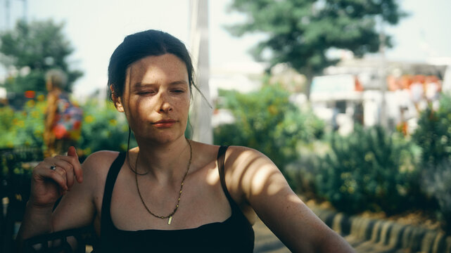 portrait of a young woman in dappled lighting