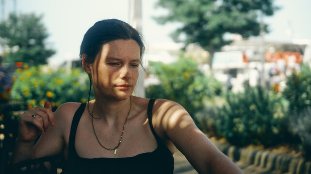 portrait of a young woman in dappled lighting