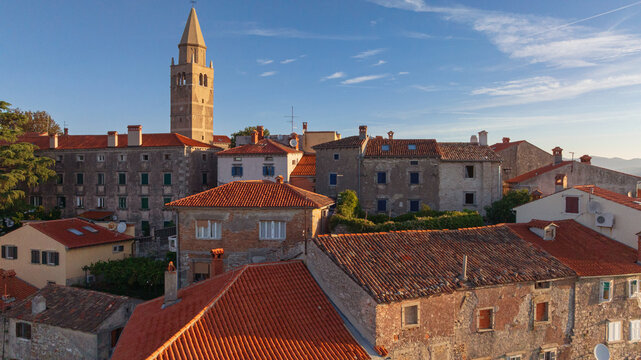 Scenic views of old town Labin in Istria, Croatia. Historic stone houses, tiled roofs, church facade, cozy narrow streets,