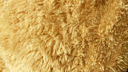 Fototapeta premium Warm caramel brown fluffy faux fur textile background texture