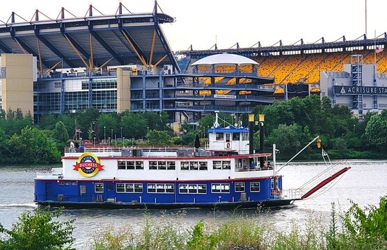 Pittsburgh, Pennsylvania, U.S.A - Jul 18, 2026 - The Gateway Clipper Duchess riverboat cruising near Acrisure Stadium