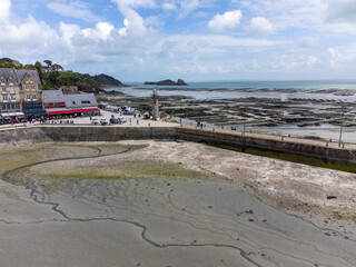 Aerial drone view of underwater oyster farms in Cancale, Brittany, exposed during low tide, raditional sustainable aquaculture and production of premium French oysters, France © barmalini