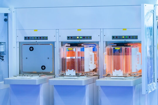 Silicon Wafer Under Cleanroom Fabrication in plastic holder box with Semiconductor inspection equipment,integrated circuits to manufacture CPU and GPU