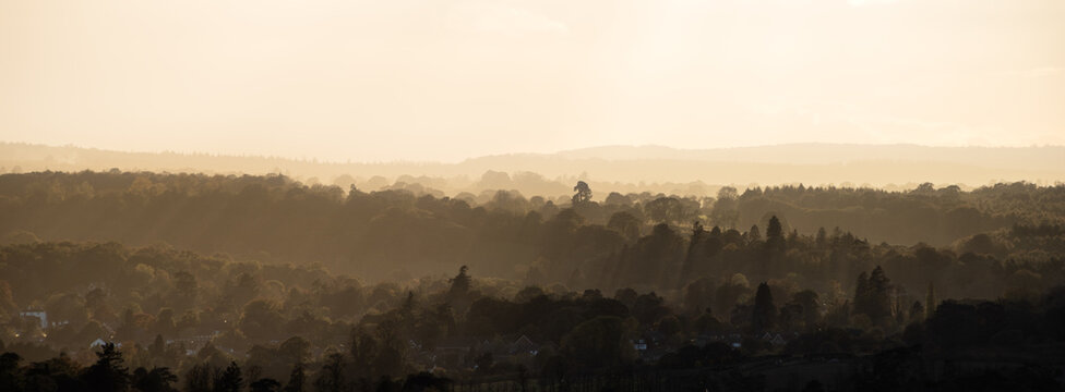 Beautiful Landscape image fo view from Box Hill in Surrey AONB during Autumn sunset