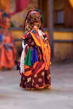 Bumthang in Bhutan, at the yearly festival in the monastery of Jakar. A monk is dancing in his colourful traditional dress and mask