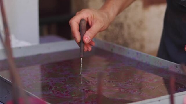 Artist Creating Traditional Ebru Paper Marbling Art