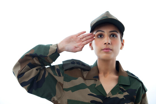 Close-up of female soldier saluting 