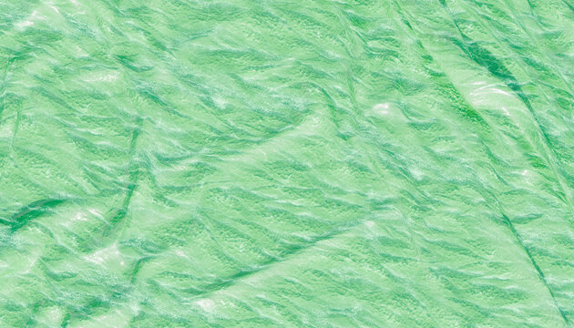 Close-up of wrinkled green textured fabric