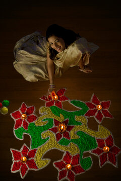 Portrait of a woman with diyas 