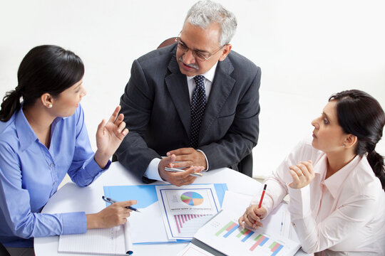 High angle view of professionals discussing together 