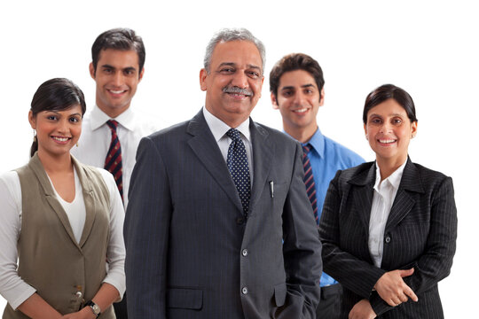 Successful business team smiling together on white background 