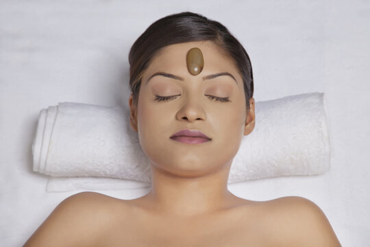 Close-up of woman getting lastone treatment 