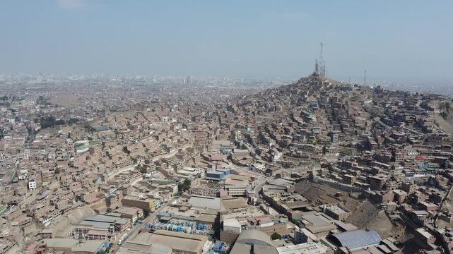 Expansive aerial perspective of the dense housing on cerro la milla in lima, peru