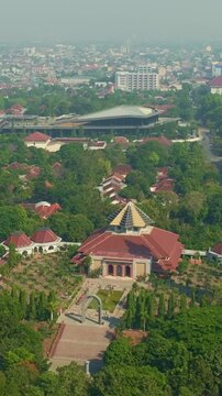 Aerial mosque complex surrounded by trees and Yogyakarta urban landscape
