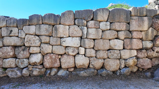 Massive ancient stone wall built with cyclopean masonry at the historic Hattusa archaeological site in Boğazkale, &Ccedil;orum, Turkey.
