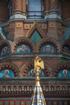 Ornate Church of the Savior on Blood mosaic facade with golden eagle
