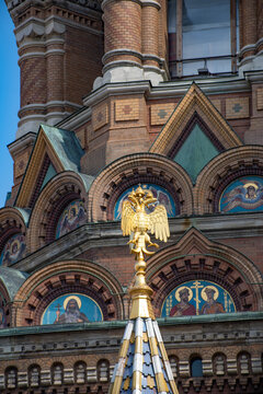 Vertical view of Church of the Savior on Blood facade with golden double-headed eagle