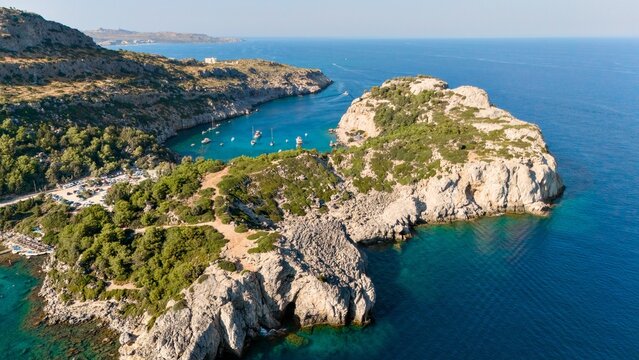 Panoramic view of Anthony Quinn Bay and surrounding hills