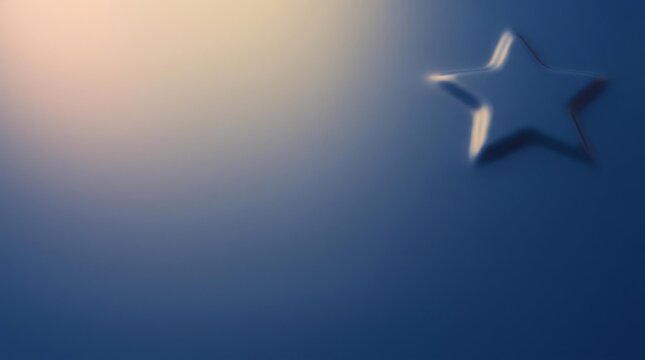A silver star shape with a soft glow emanating from the left.