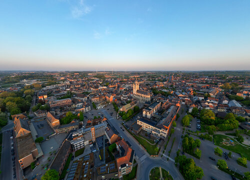 Halle, Vlaams Brabant, Belgium, 27th of April, 2025, A stunning aerial perspective that beautifully showcases a bustling cityscape during the enchanting twilight hours