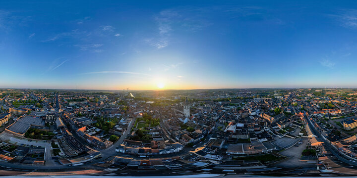 Halle, Vlaams Brabant, Belgium, 27th of April, 2025, A stunning aerial panorama beautifully showcasing a vibrant and bustling cityscape during the picturesque dawn