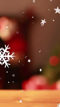 Multiple stars and snowflakes icons floating against bokeh spots of light in background