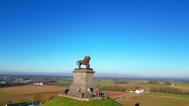 Napoleon Battlefield, Waterloo, Walloon Brabant, Belgium, March 4th, 2025, Aerial view of a magnificent lion statue on a hill, surrounded by beautiful landscapes that captivate all