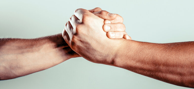 Handshake, friends greeting, teamwork friendship. Rescue, helping gesture or hands Strong hold