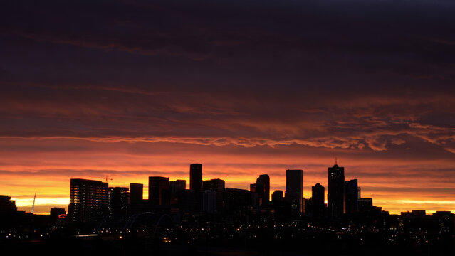 Downtown Denver Skyline beneath Fiery Sunrise Sky