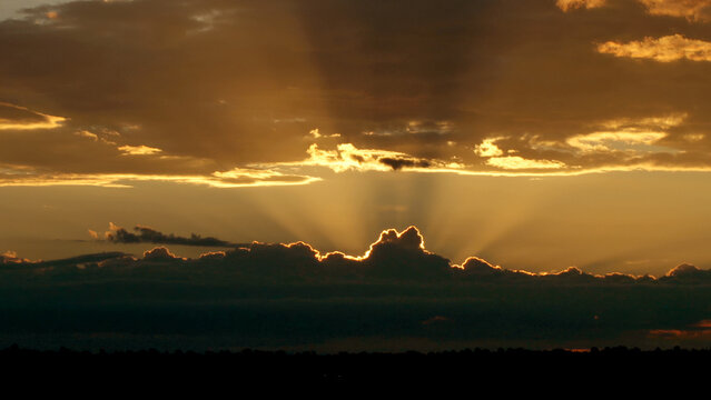 Heavenly Golden Sunrise Breaking Through Storm Clouds