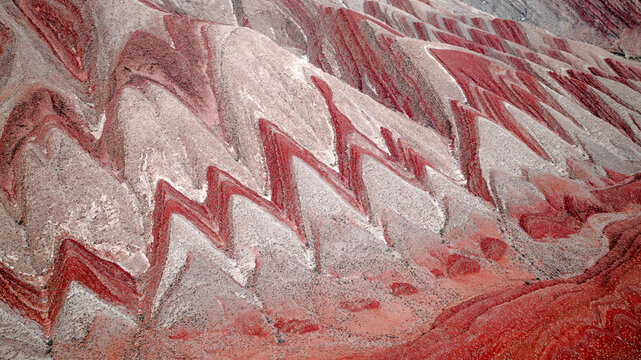 Aerial view of the intricate geological folds and red rock strata of the landscape near Moab, Utah, United States.